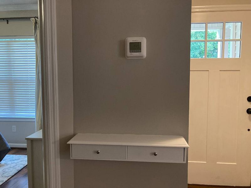 Foyer landing and entrance to first bedroom