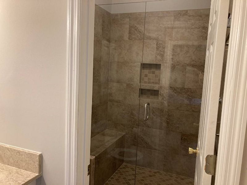 Master walk in shower with bench