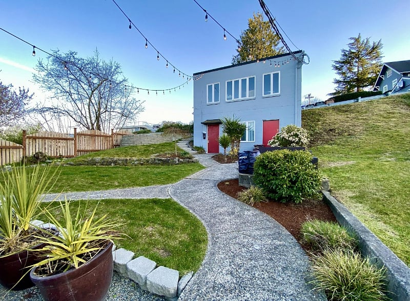 Entry is the red door on the left. The door to the right leads to a tool shed. Upstairs is a rarely used garage. See pics of updated deck!