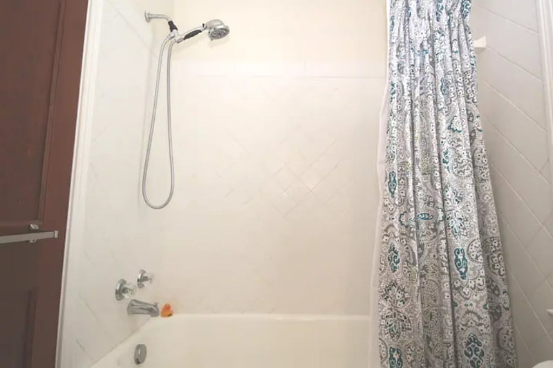 Shower/tub combo complete with rubber duckie.