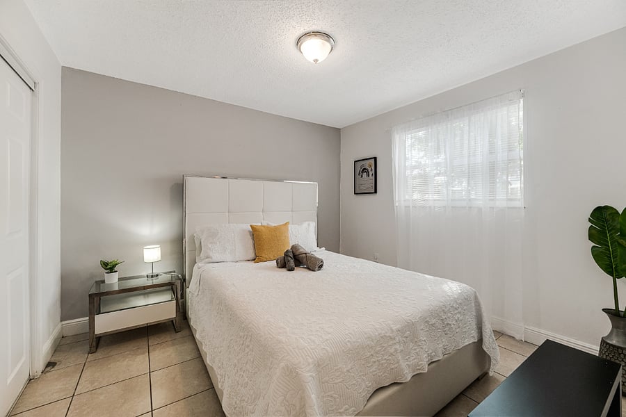 Comfortable second bedroom with a queen-sized bed, ideal for guests or family.
