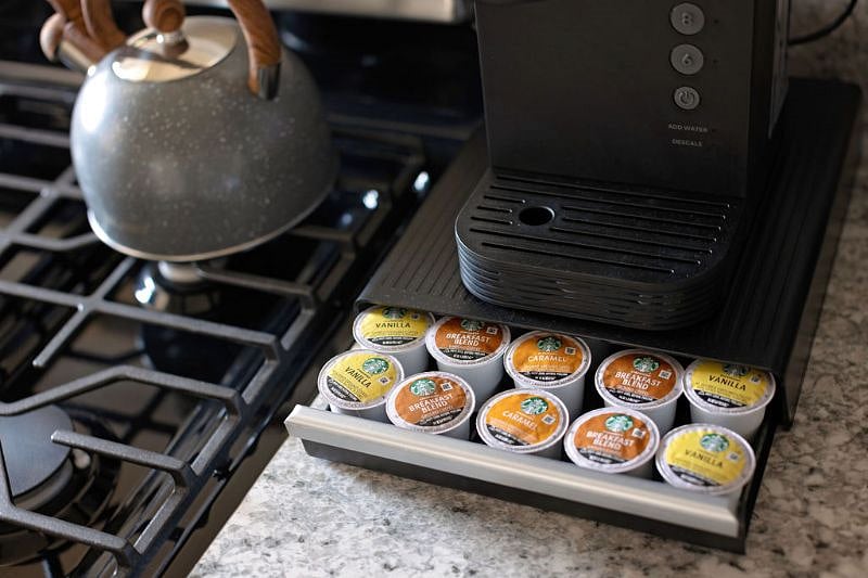 Keurig machine and tea kettle along with variety of kcups provided for you
