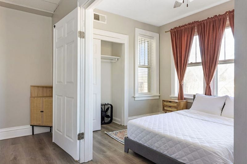 Shelves, closet and hangers in this room for clothes storage
