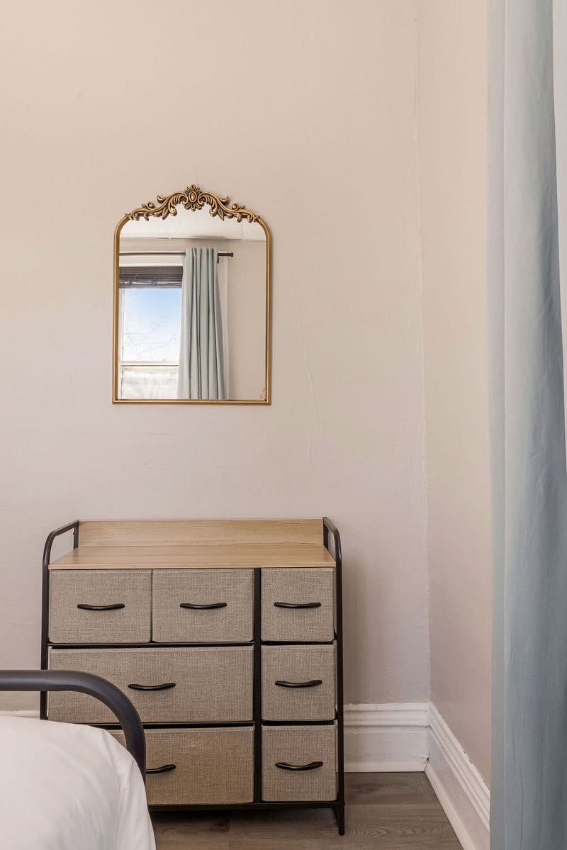 Drawers and closet with hangers available in this room for clothes storage