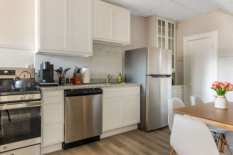 Gas stove, dishwasher, full size fridge with freezer, microwave, and toaster along with basic cooking utensils all provided