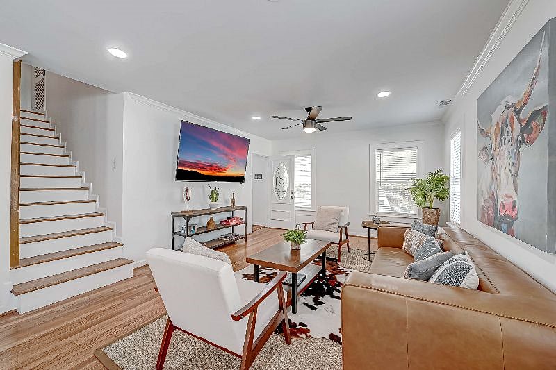 1712 Fairview 77006: Living Room with 75" Roku TV, Front Entrance and Stairs to the Third Floor. 