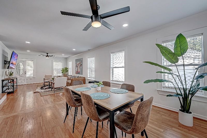 1712 Fairview 77006: Dining Room and Living Room with 75" Roku TV. 