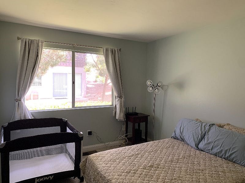 third bedroom: full bed, optional baby / toddler crib