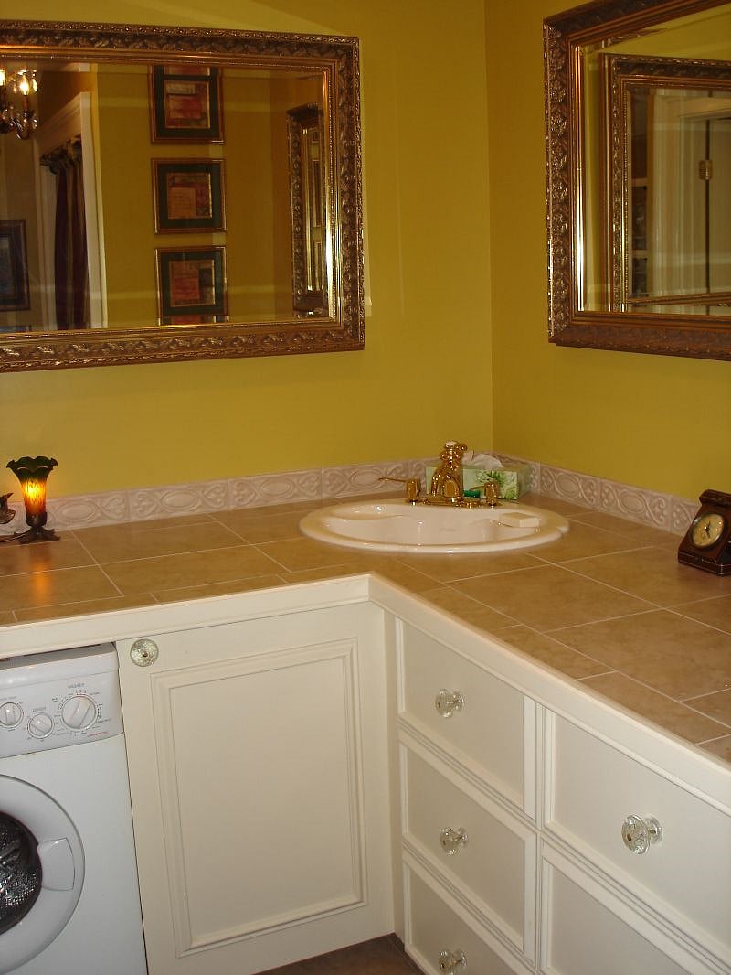 The bathroom has large 30-inch deep drawers for clothes and serve as what would be dresser space. There is also a clothes closet in here.