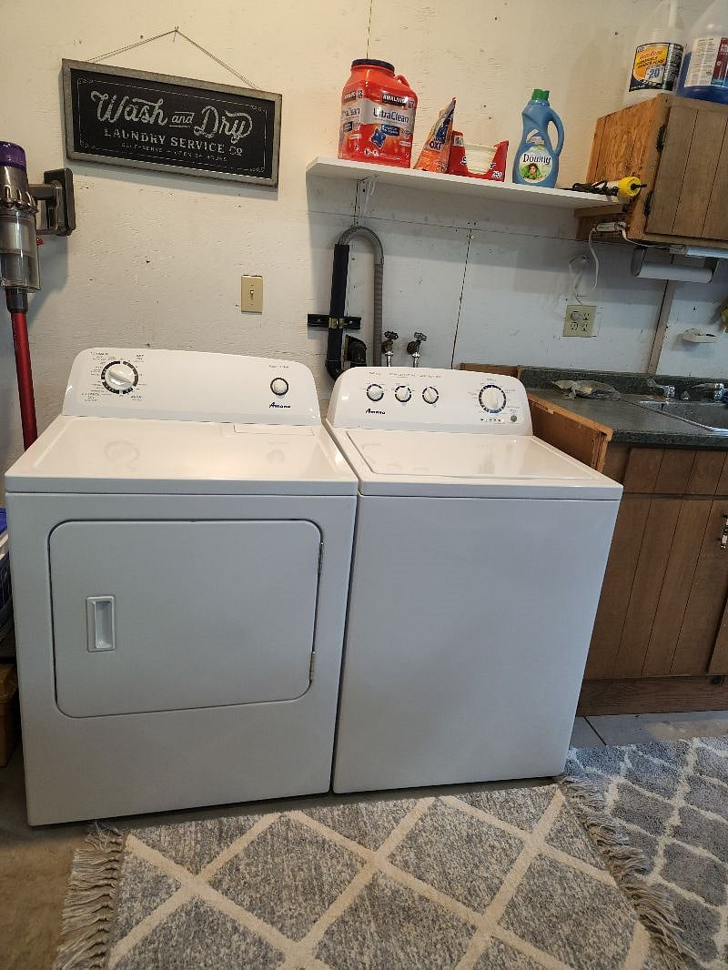 Washer/Dryer and all laundry cleaning supplies below the unit.