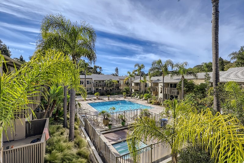 Lap size pool with ample outdoor tables and lounge chairs. Southern exposure.