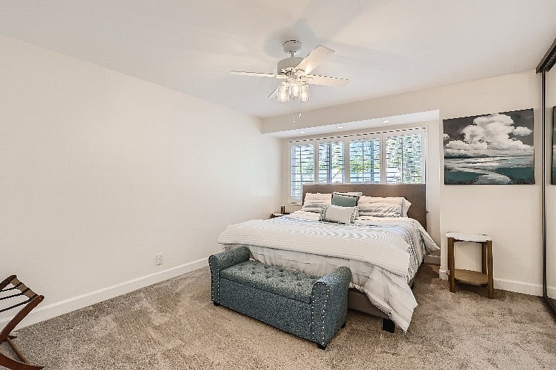 King size bed with ample cozy blankets and pillows.
