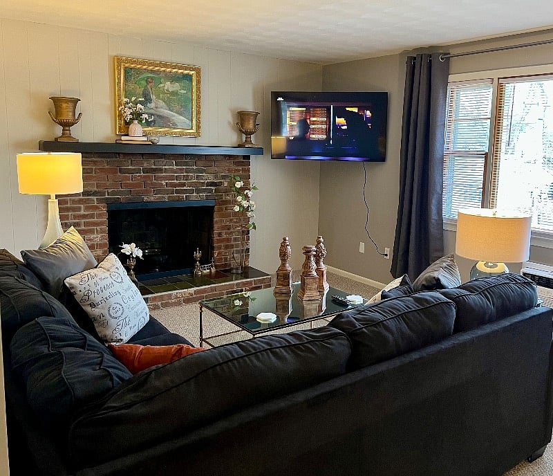Apartment B: Family Room featuring a 55 inch Smart Television mounted on a swivel and tilt bracket.