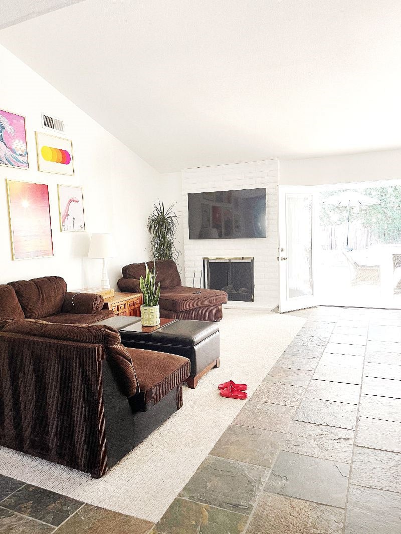 Living room opens to backyard oasis