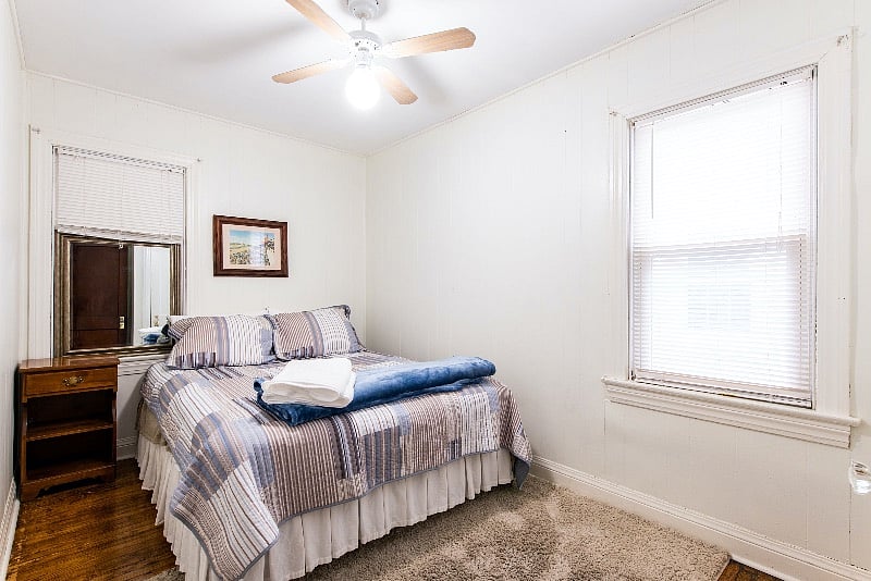 2nd bedroom with queen bed, closet and storage