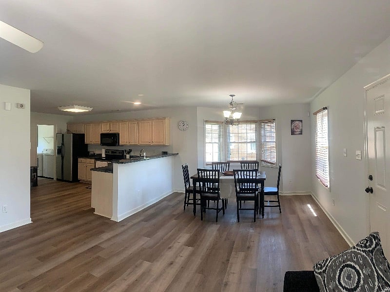 Full view of kitchen and open space to the dinning room . All brand new noise reduction flooring 