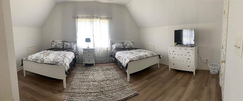 One huge bedroom upstairs sleeps 4 people . Bathroom is shared ($1000 a month ) utility included . Has Tv and internet . 