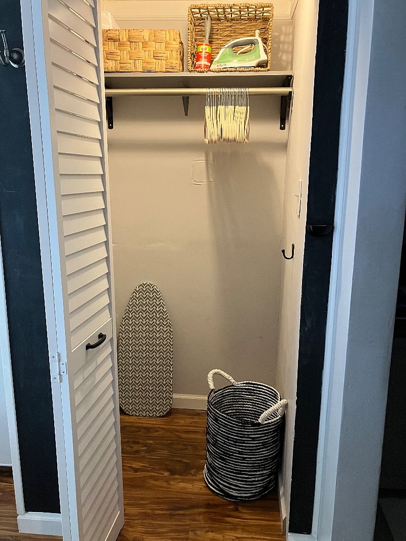 Interior of closet. Iron, and small ironing board included.