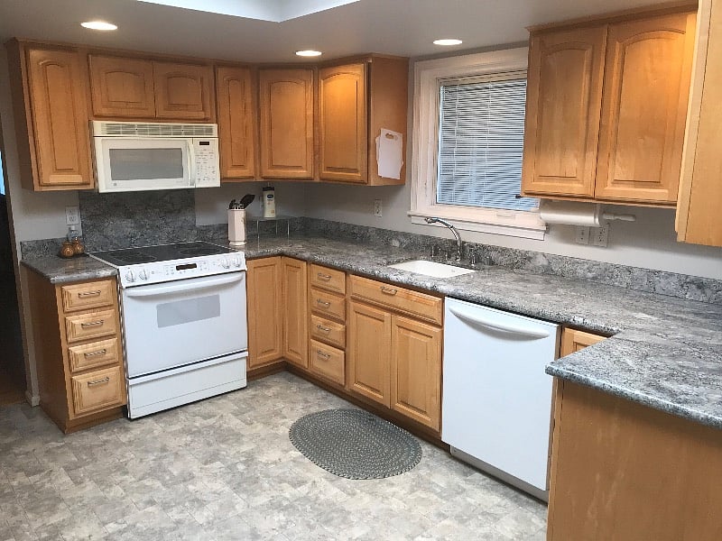Kitchen with electric range, refrigerator, microwave, dishwasher and disposal. Lots of cabinet storage.
