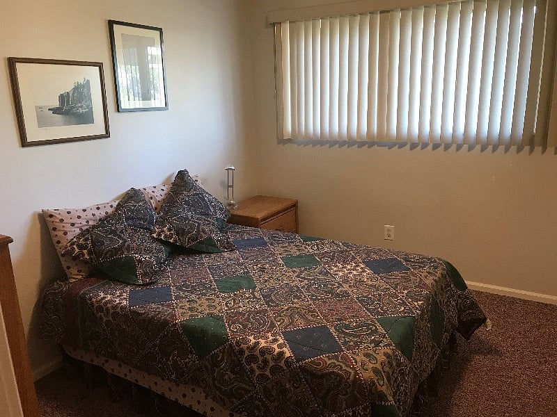 Second bedroom with full size bed, dresser, closet