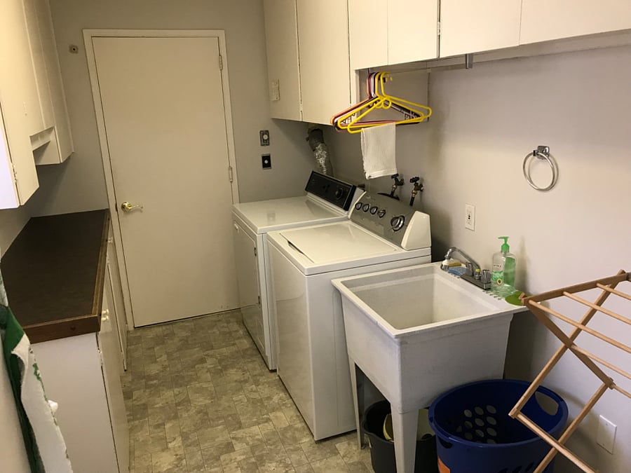 Laundry room with gas dryer, electric washer and utility sink