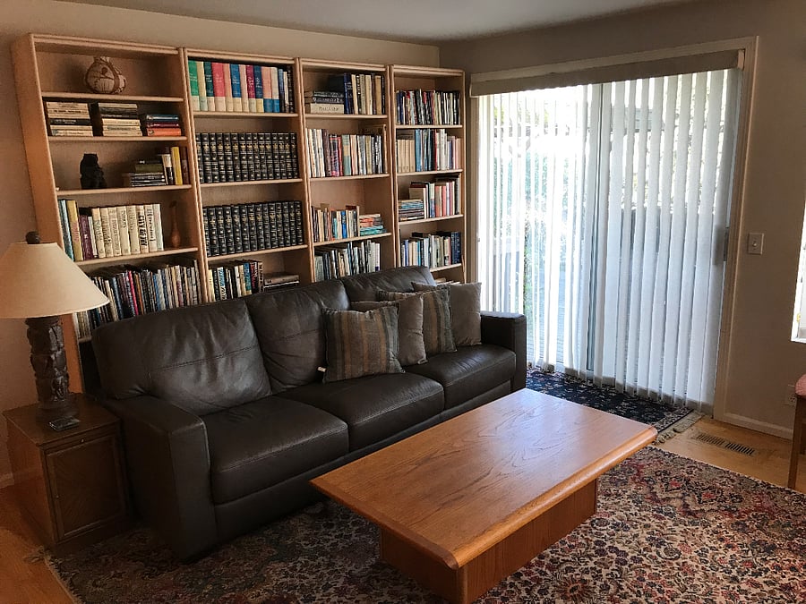 Living area, sliding door to outdoor deck, fully fenced backyard.