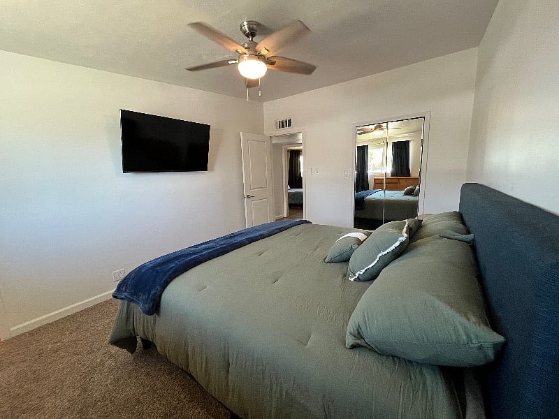 View of mounted, 50-inch smart TV in your bedroom. 