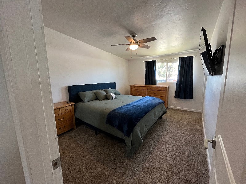 Your Master, King Bedroom comes with a brand new mattress, sheets, comforter, black-out curtains, walk-in closet, dresser, nightstand, 50-inch voice-control smart TV, ceiling fan, and in-suite full bathroom with brand new towels. 