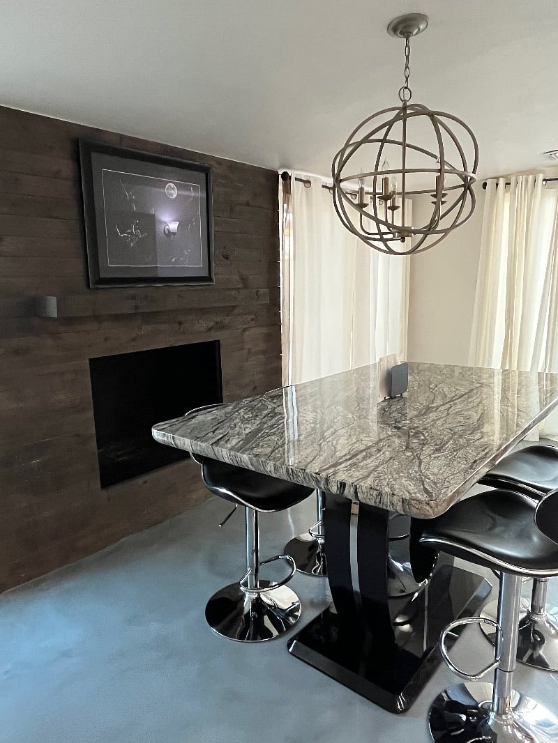 Dining table and view of fire place. 