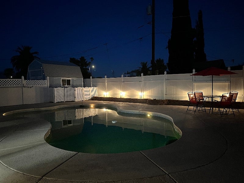View of pool at nightfall. 