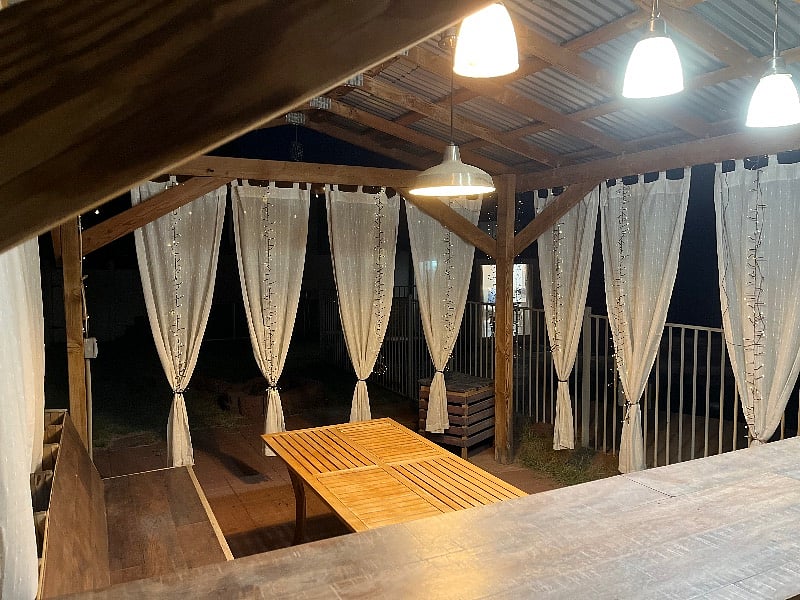Pergola is furnished with a table and bench, as well as a bar!