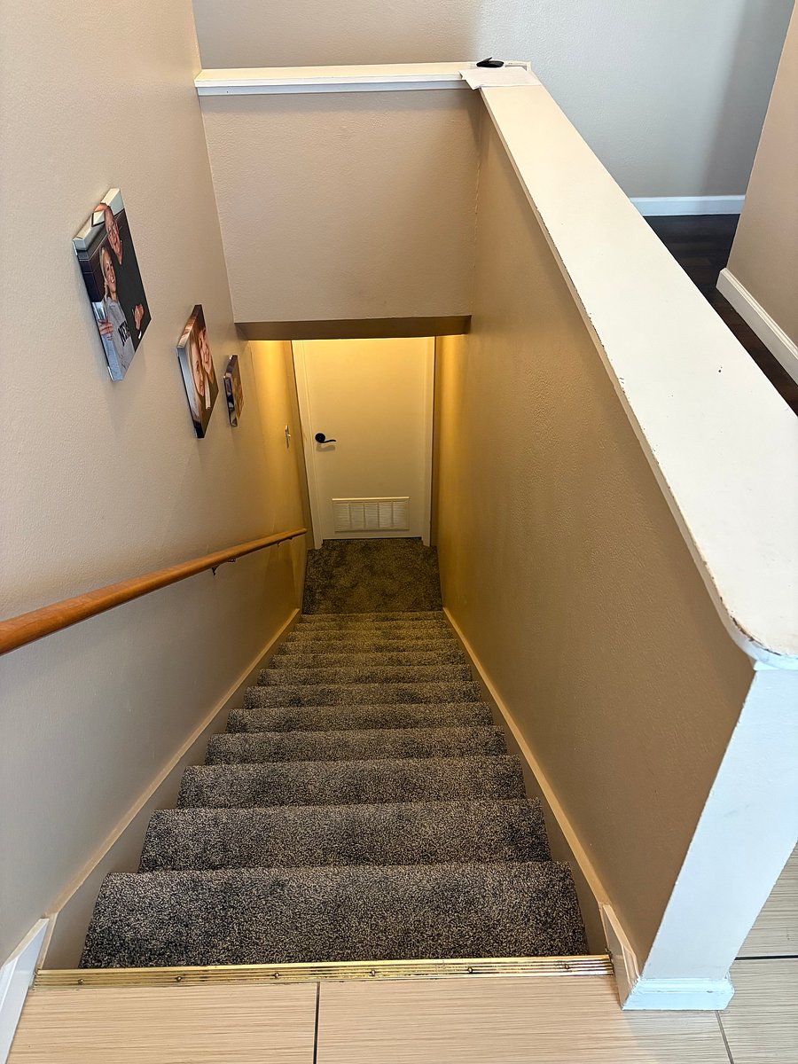Stairs leading to your apartment from the front entrance.