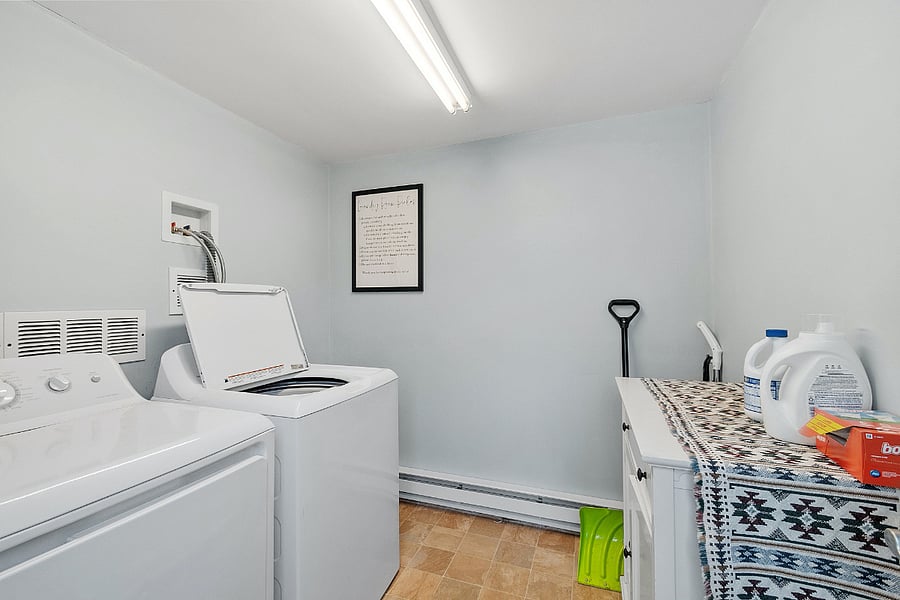 New washer and dryer in shared laundry room - maintained by professional cleaners