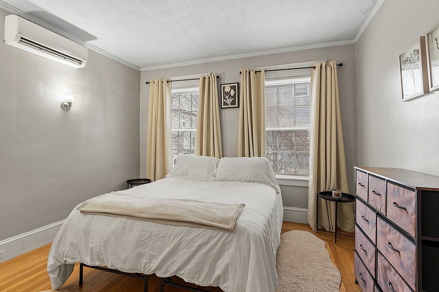 Spacious bedroom featuring a queen bed, dresser, and closet. A peaceful retreat for relaxing, sleeping, and keeping your belongings organized during your stay.