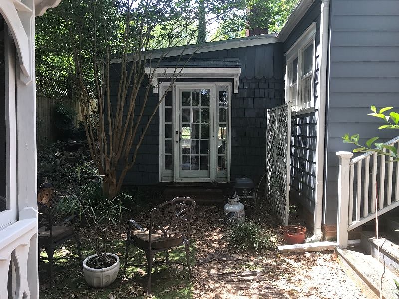 Back entrance with several outdoor entertaining / gathering spaces 