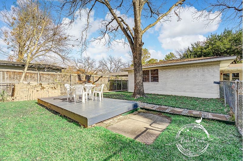 Separate gated backyard with sundeck.  