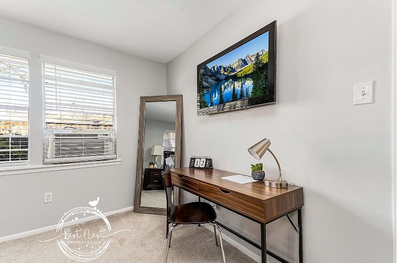 Bedroom features desk area with mobile compatible printer and fast wifi, full size mirror and smart TV. 