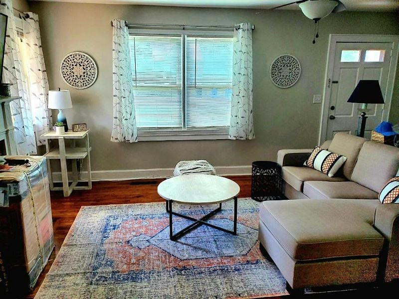 Comfortable sitting area in living room with 56" Roku TV 