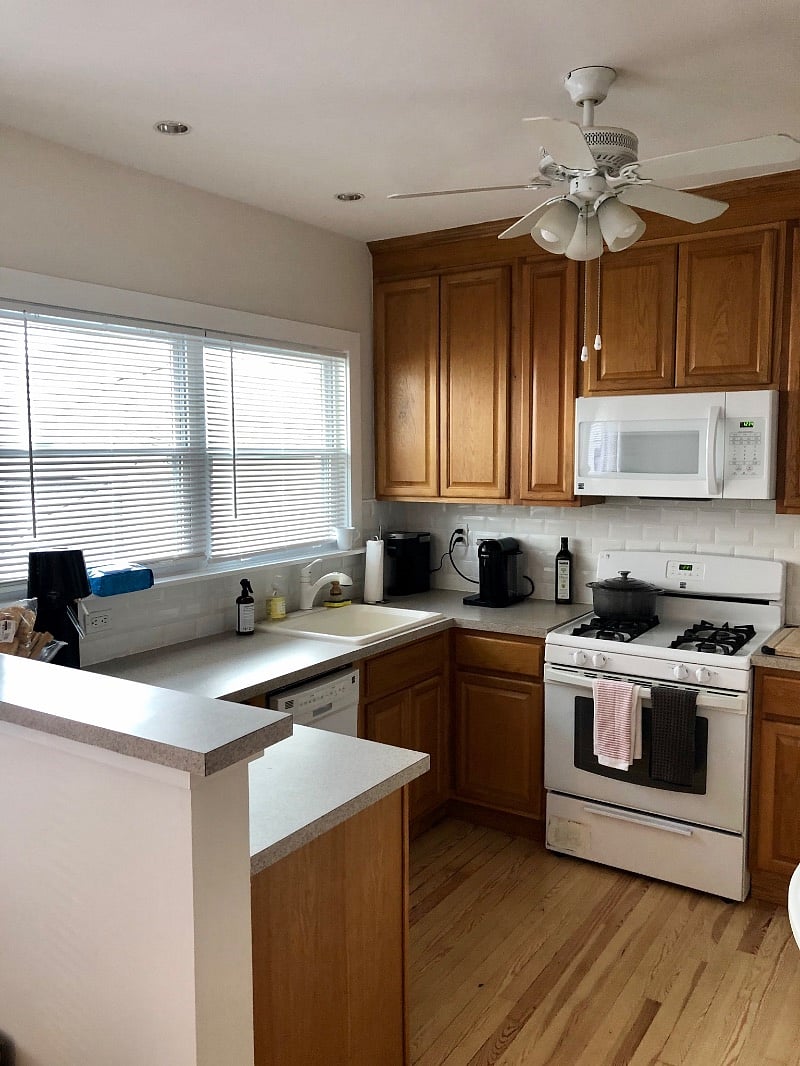 Fully stocked kitchen with microwave and fridge
