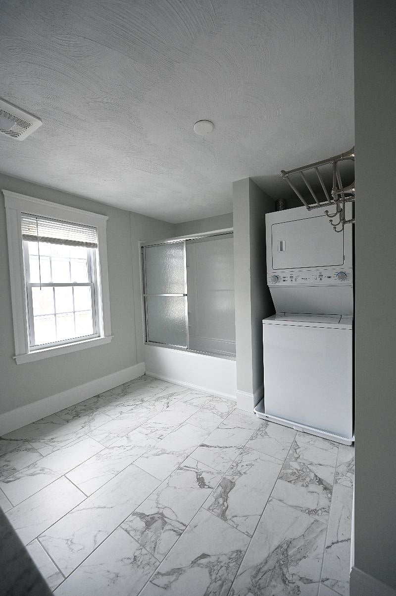 Your oversize bathroom has a double vanity, a full tub and exclusive laundry.