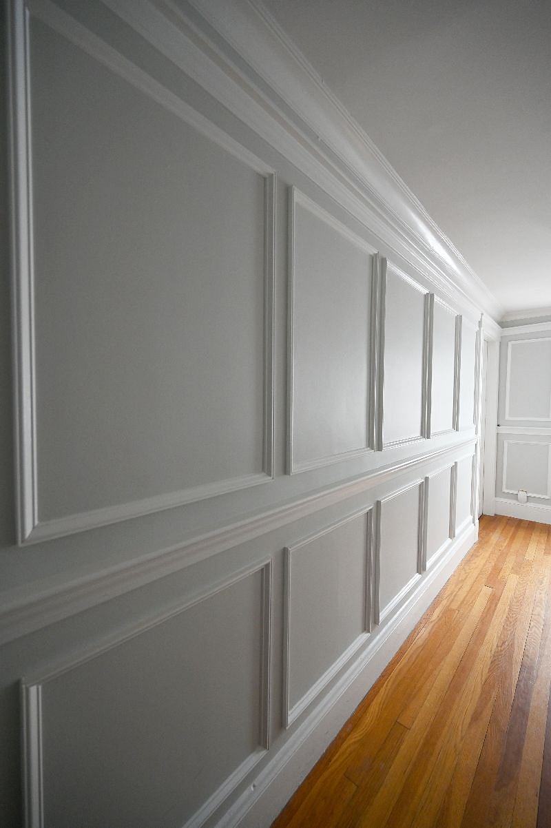 The home is outfitted with decorative wainscoting.