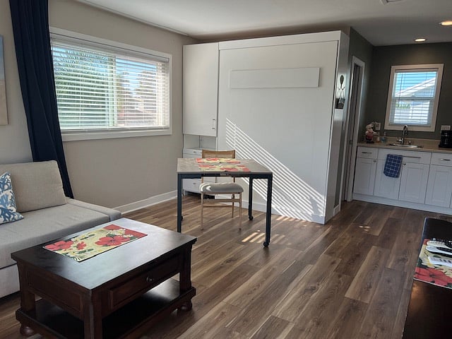 This table is on wheels. It is adjustable and can be changed to 3 different sizes.