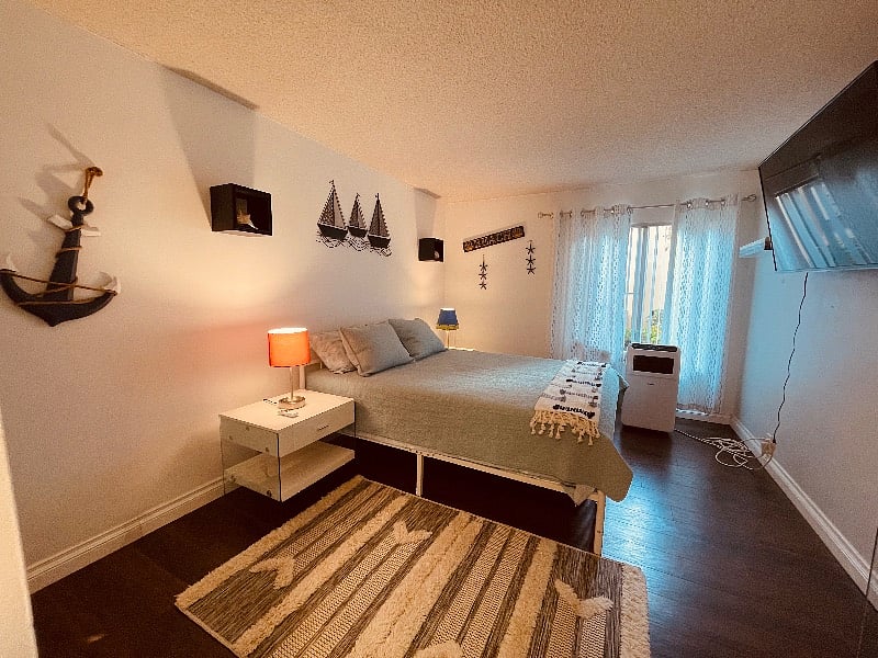 Master Suite 1 in nautical theme with smart TV. Portable
AC.