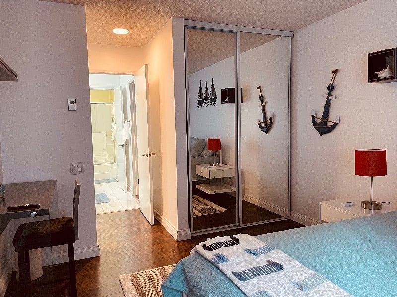 Master suite 1 with 2 mirrored door closets and desk