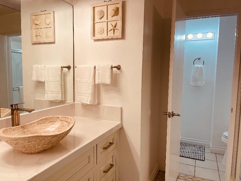 Master suite 2 bathroom with stylish vessel sink & lighting and mirrored closet doors