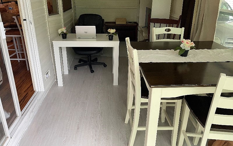 Bonus patio office space with xtra dining & tv area with futon.