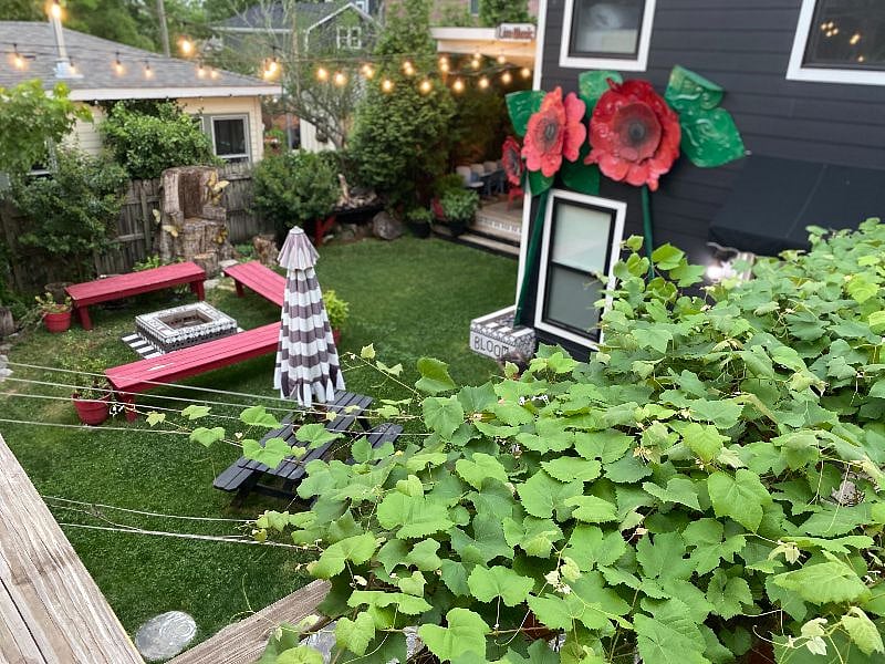 View from your private porch, looking down on the garden, fire pit & corner stage.