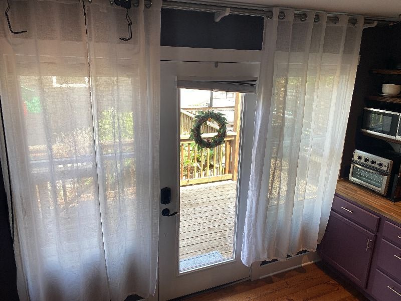 A wall full of beautiful natural light by day & black out blinds to make it dark to rest.
