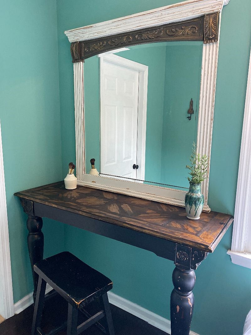 Vanity with beveled mirror to use when getting ready in the morning or use as a desk if needed.