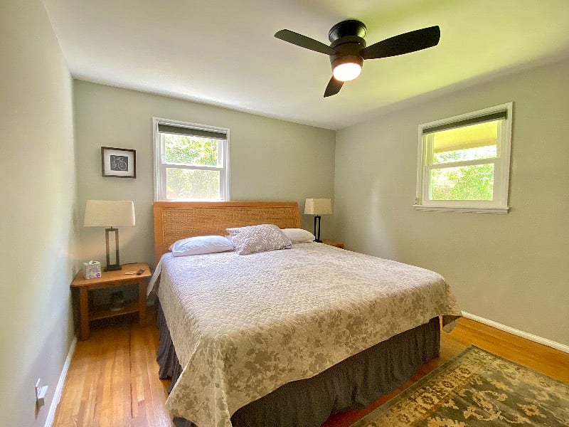 Primary bedroom with room darkening shades, king bed with memory foam topper